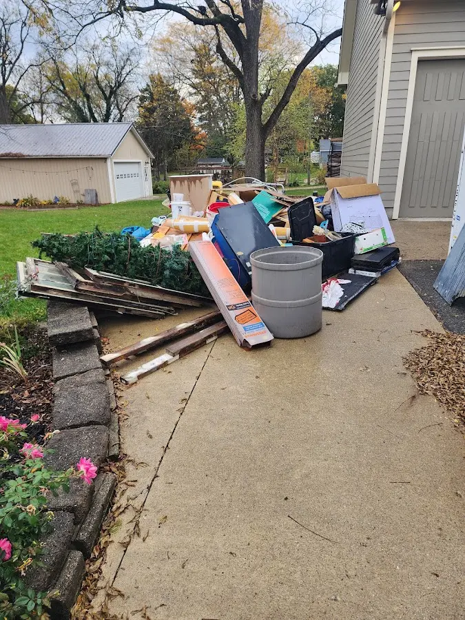 Dumpster being loaded with debris for 10 Yard Dumpster Rental in Taneytown